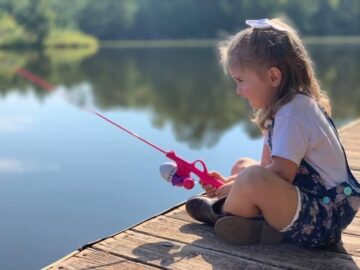 Little Girl Fishing On Pond